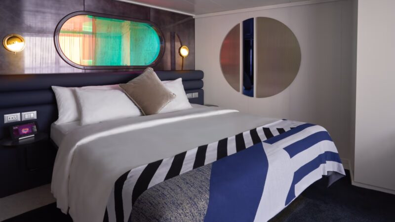 A cruise ship cabin with bed
