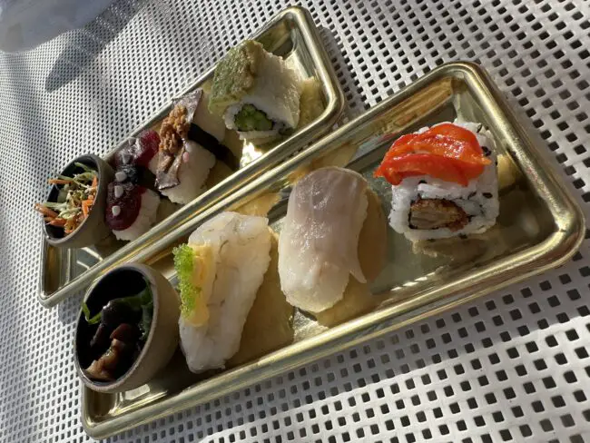 Two plates of sushi on richards rooftop bar