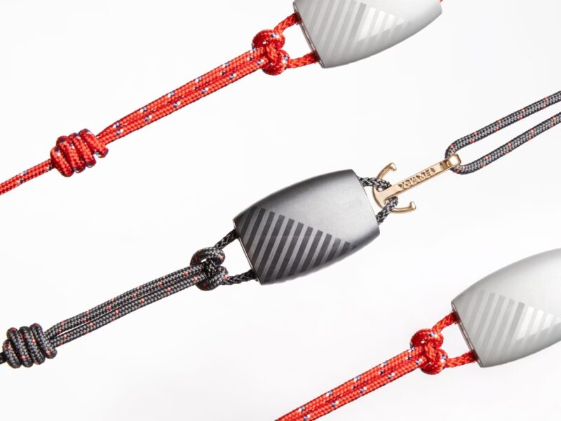 Three Virgin Voyages® bands, 2 red and one balck rope-style bands each with an anchor-shapes clasp