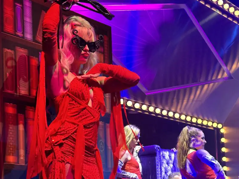 A woman dressed in red on stage