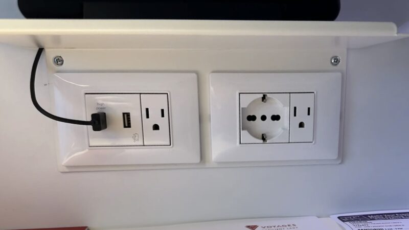 A row of power sockets, 2 USB-A, European and USA electric outlets