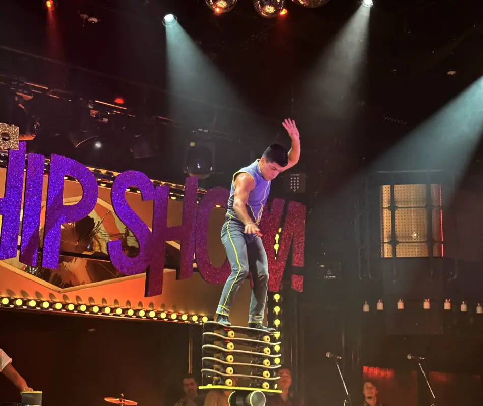 A performer balancing on a set of skateboards