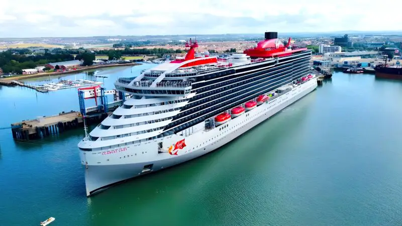 A cruise ship in port under an overcast sky