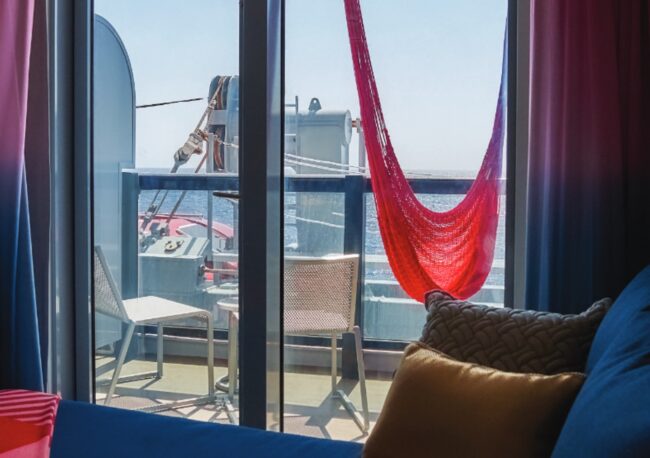 Cabin balcony with a view of machinery and life boats