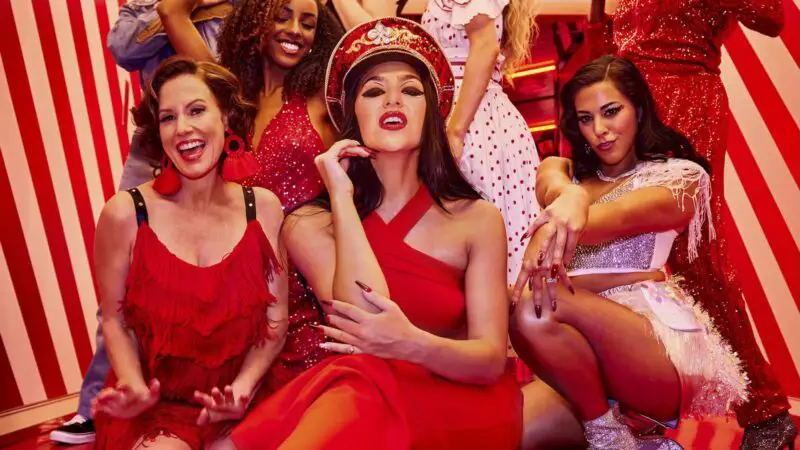 A group of people dressed in red partying in a red room