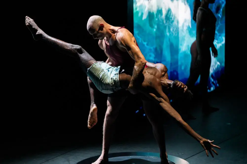Two dancers holding eachother