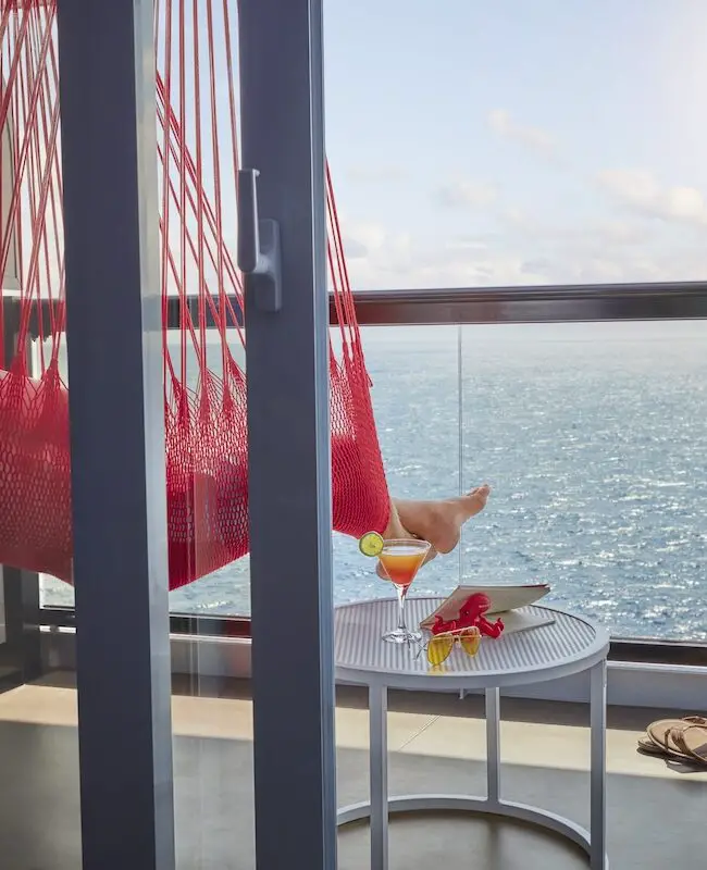 A person lounging in a hammock