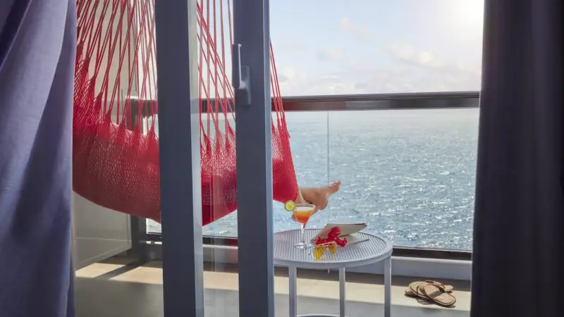 A person lounging in a hammock