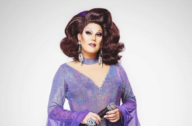 A Drag queen dressed in purple