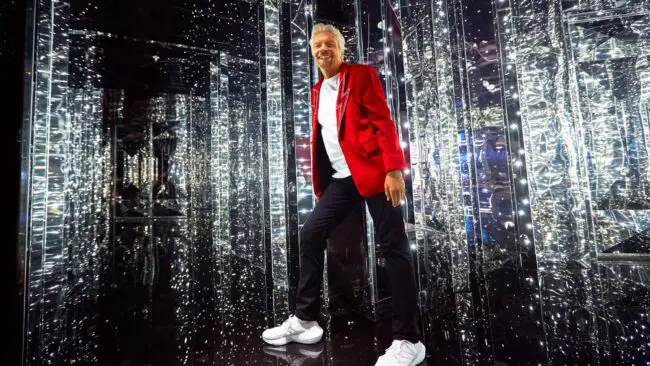 Richard Branson in a corridor with lights
