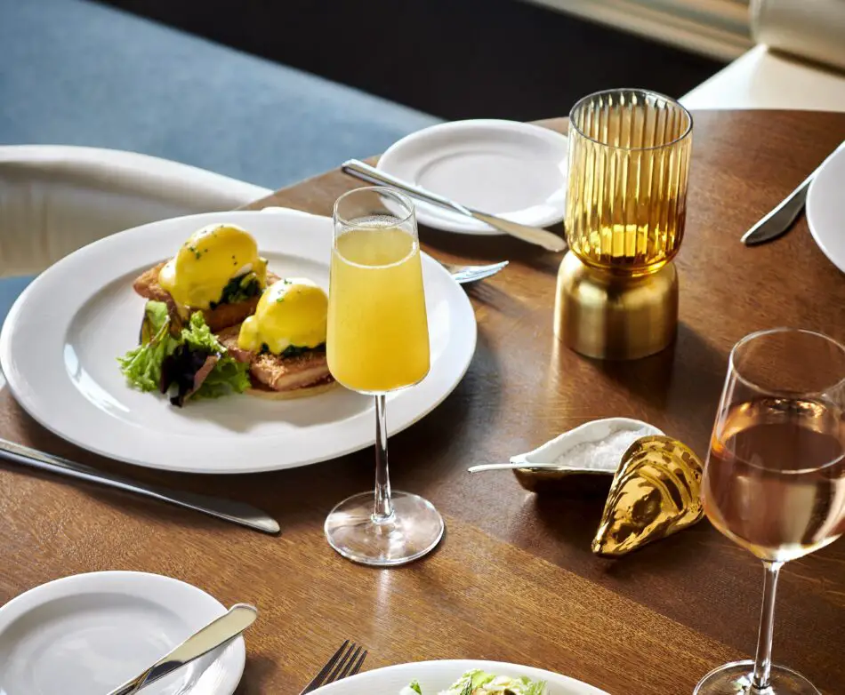 A table set for bottomless brunch at The Wake eatery onboard Scarlet Lady.