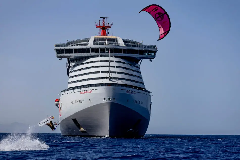 Tom Bridge kitesurfs off of Virgin Cruise Ship at sea in the Greek islands in Greece