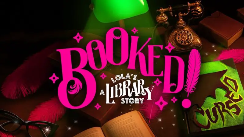 Poster-style promotion for Booked Lola's A Library Story with bright pink BOOKED lettering and desk accessories