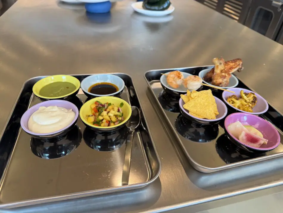 A tray of 4 mystery dips next to a tray of snacks