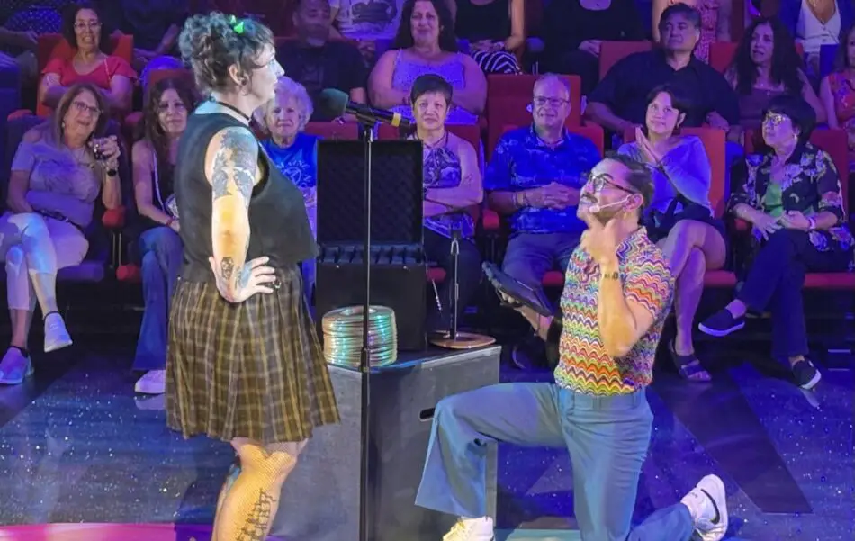 A volunteer singer takes part in finish the lyric