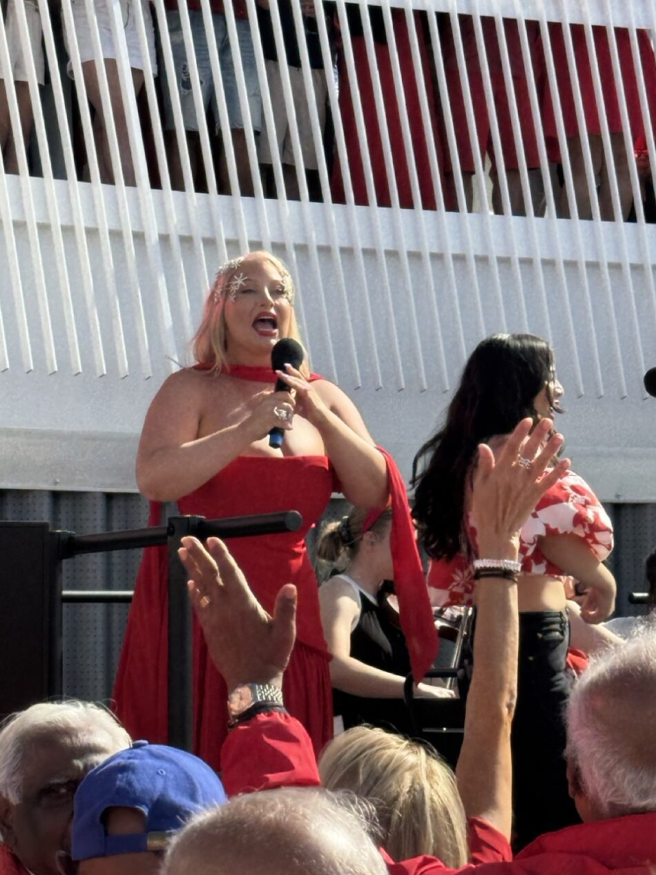 Abi the Hostess helped lead the 'Pub Choir' on board Brilliant Lady as she entered New York Harbor