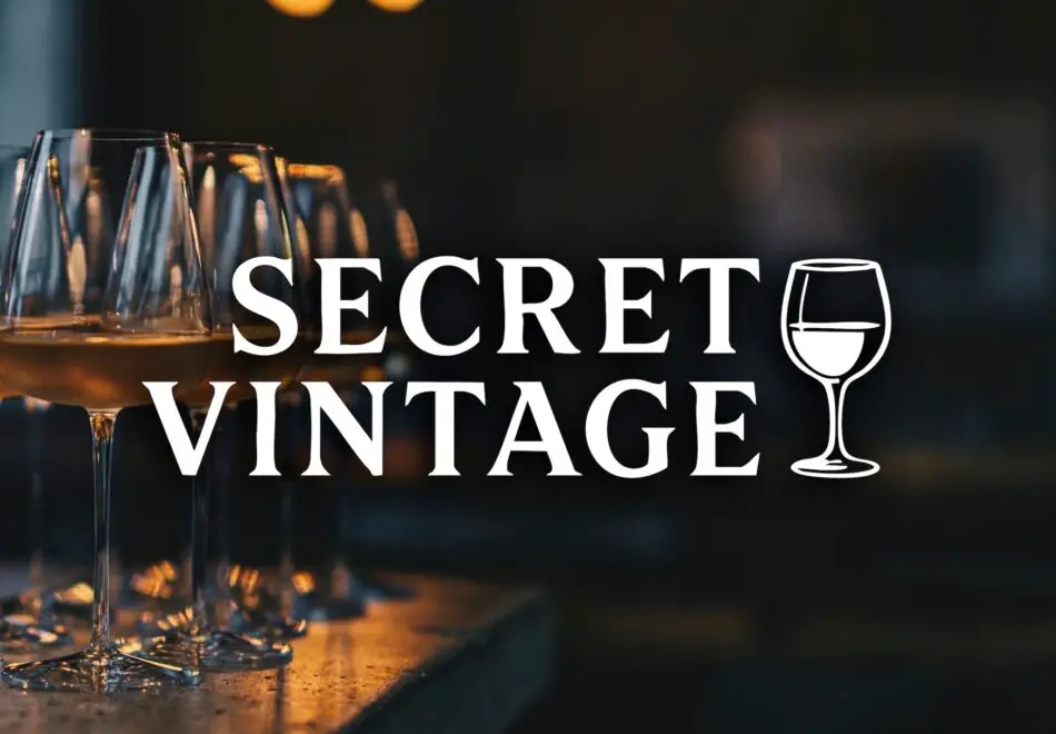 Wine glasses on a bar with Secret Vintage text overlay