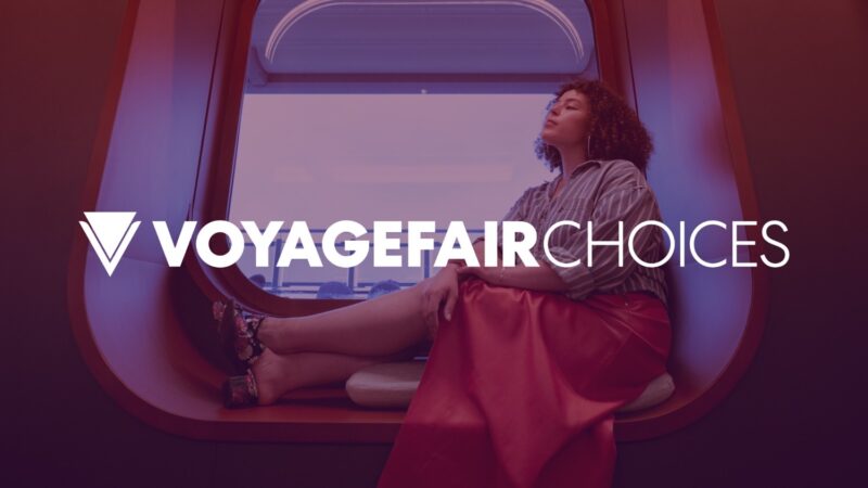 Person in a Virgin Voyages cruise cabin with purple lighting and VoyageFairChoices branding