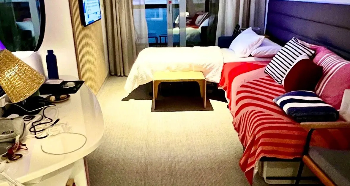 Virgin Voyages cruise ship cabin with balcony and sea view