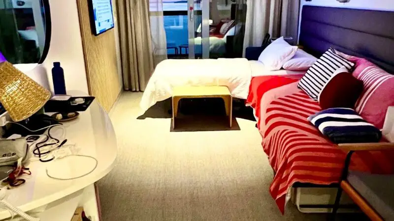 Virgin Voyages cruise ship cabin with balcony and sea view