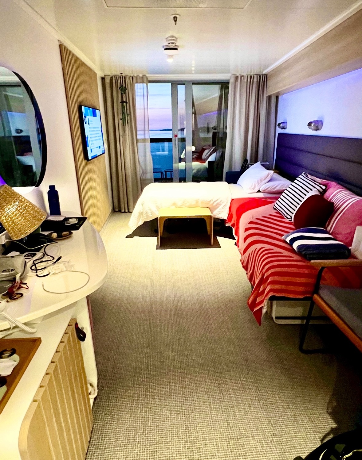 Virgin Voyages cruise ship cabin with balcony and sea view