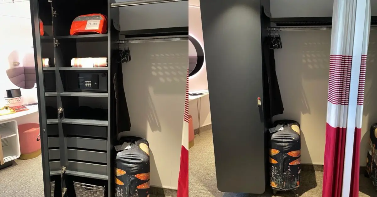 Virgin Voyages cabin closet with safe, shelves, and luggage beside curtain