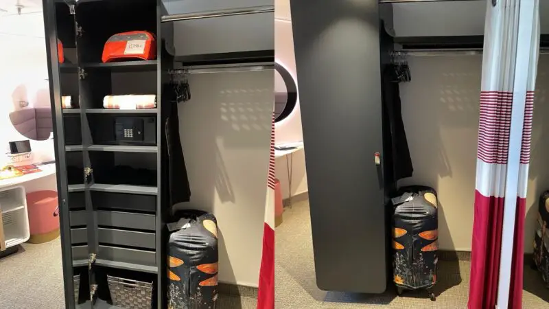 Virgin Voyages cabin closet with safe, shelves, and luggage beside curtain