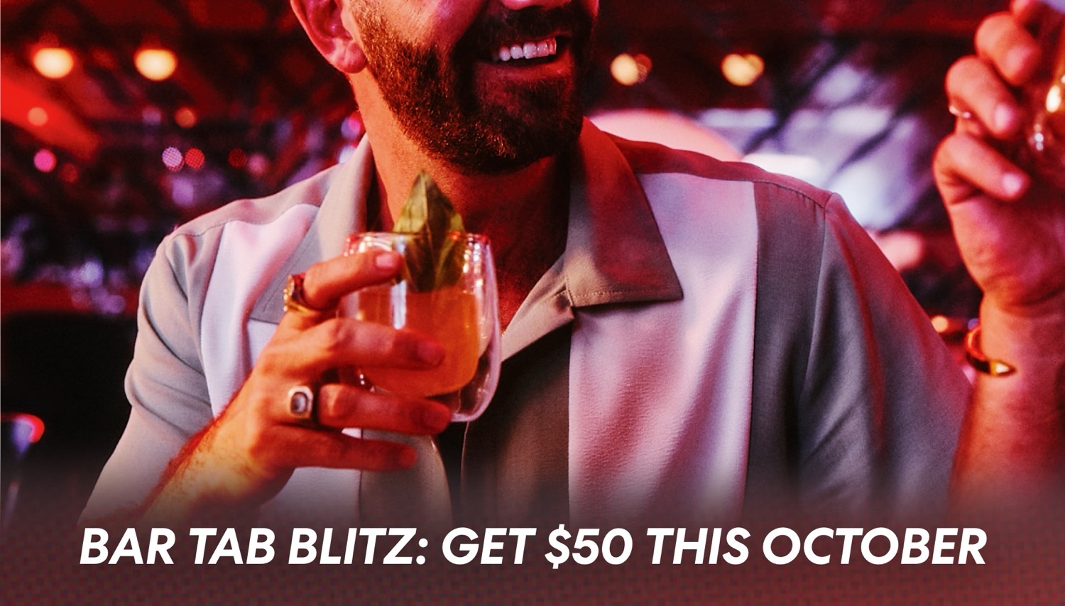 Man in a bar holding an orange cocktail with garnish; promotional text Bar Tab Blitz: Get $50 This October