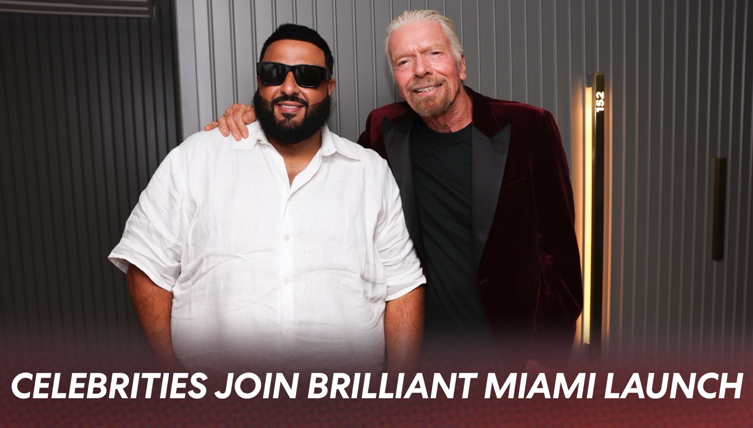 Two men pose for a photo at a Miami launch event
