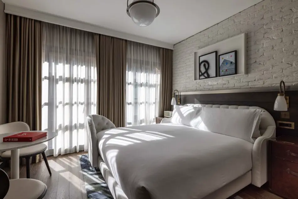 Hotel room with a large bed at Virgin Hotels London-Shoreditch