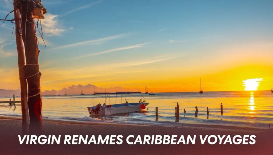 Sunset over calm sea with a small boat near the shore