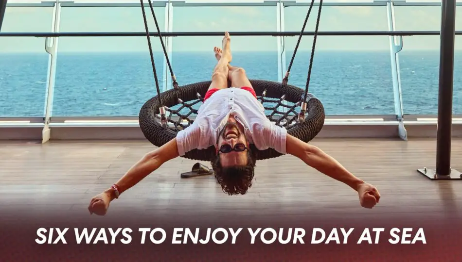 Man lounging in a circular rope chair on a cruise ship deck with the sea in the background