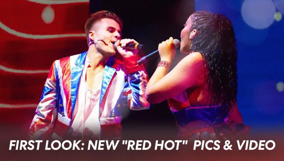 Two performers sing into microphones on a brightly lit stage