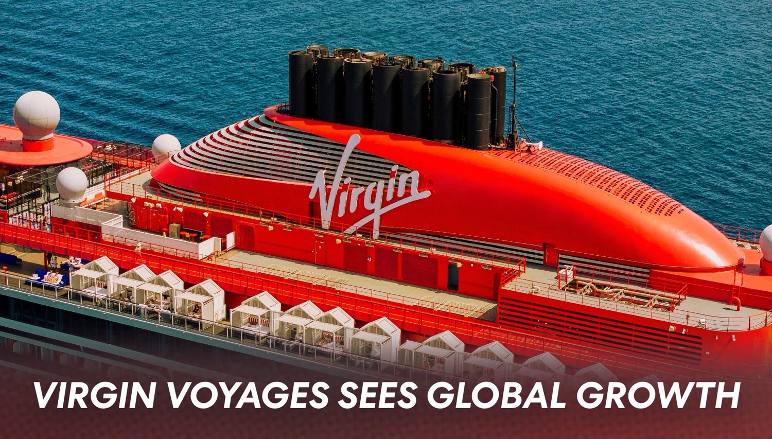On a Virgin Voyages cruise ship, a bright red exterior with white cabana structures on deck