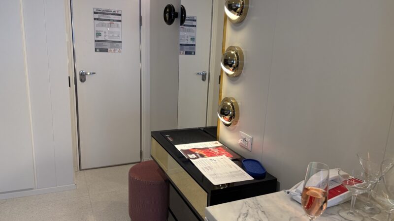 Virgin Voyages cruise ship cabin with illuminated vanity mirrors