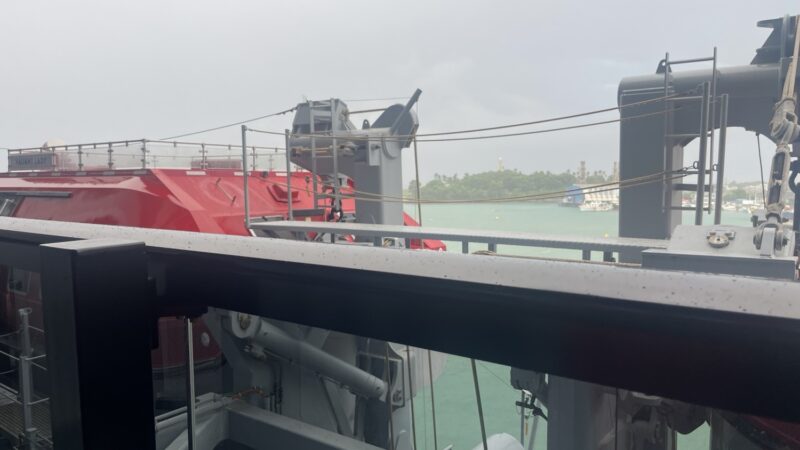 View from a Virgin Voyages cabin balcony overlooking port with Valiant Lady