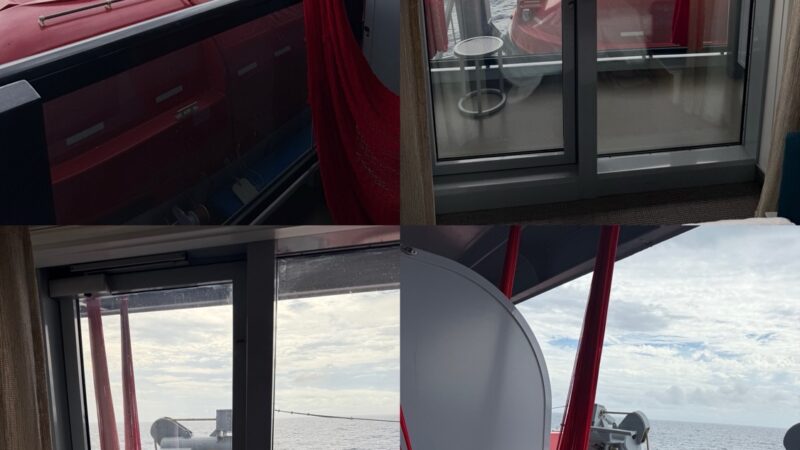 Inside a Virgin Voyages cruise ship cabin with a red hammock by the balcony door overlooking the ocean