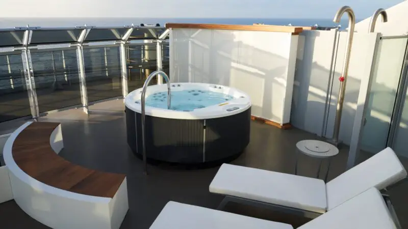 Circular hot tub on a Virgin Voyages cruise ship balcony overlooking the ocean
