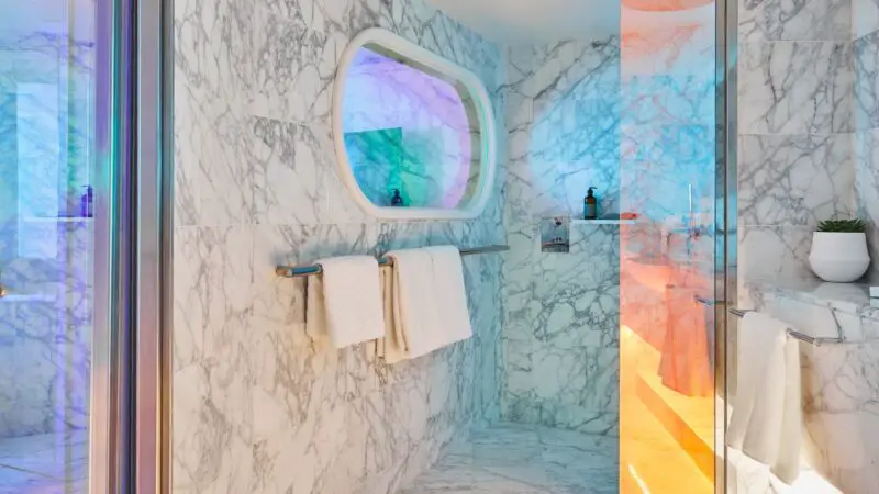 Luxurious marble bathroom on a Virgin Voyages cruise ship