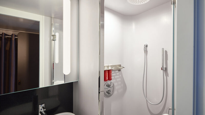 Virgin Voyages cruise ship cabin bathroom with rainfall shower