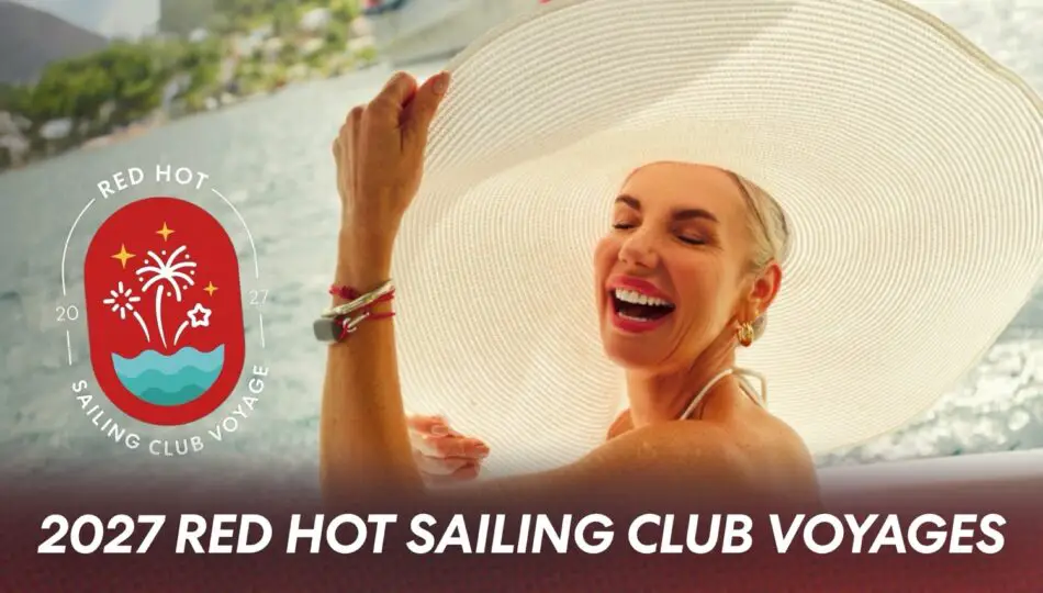 Smiling woman in a wide-brimmed hat on a cruise deck with the 2027 Red Hot Sailing Club Voyages logo