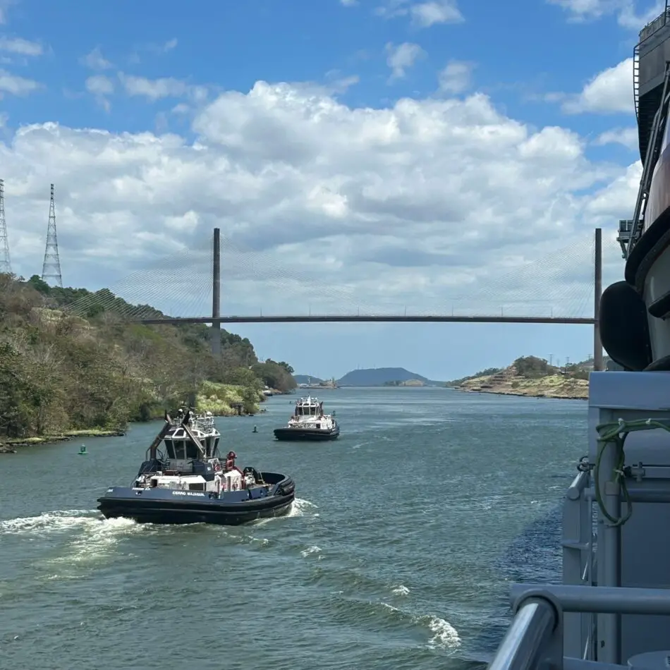 View from a Virgin Voyages cabin balcony of a river with a cable-stayed bridge