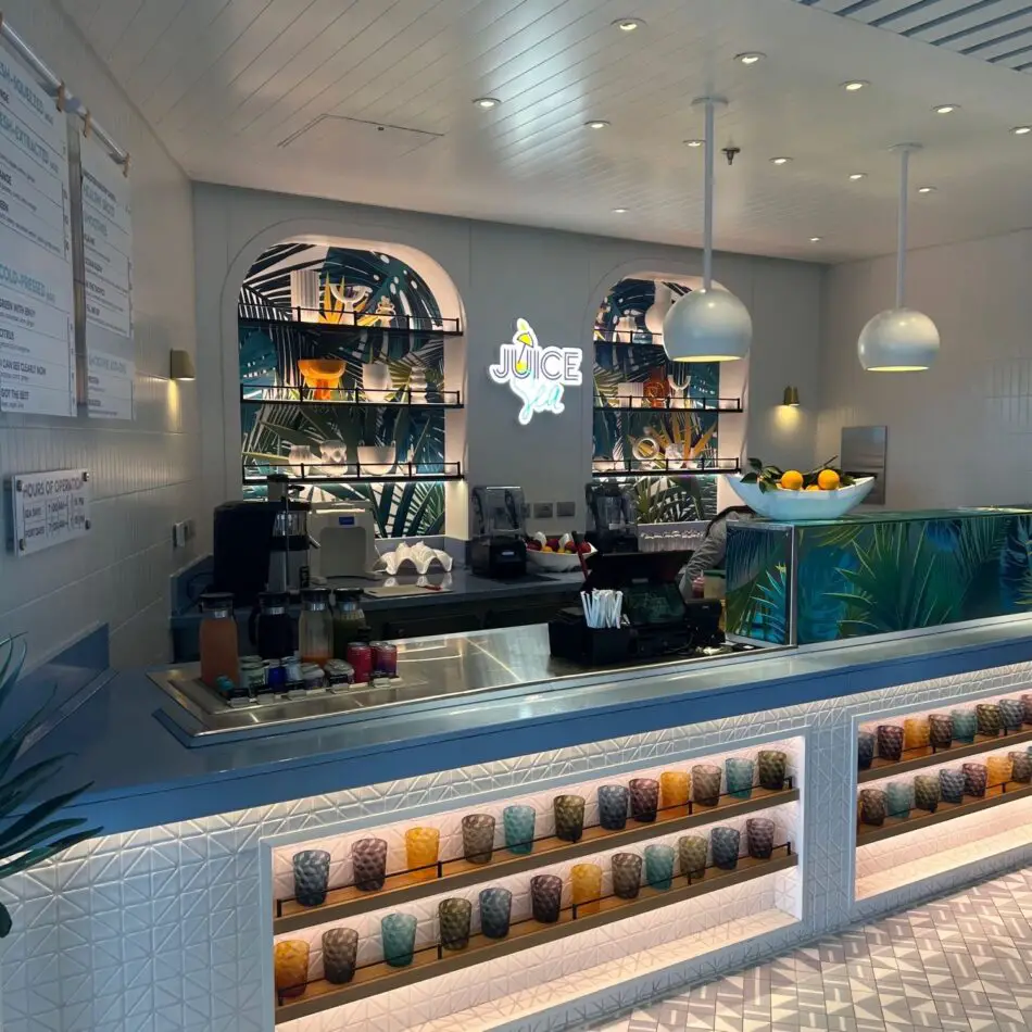 Bright juice bar with tropical decor on a Virgin Voyages cruise ship