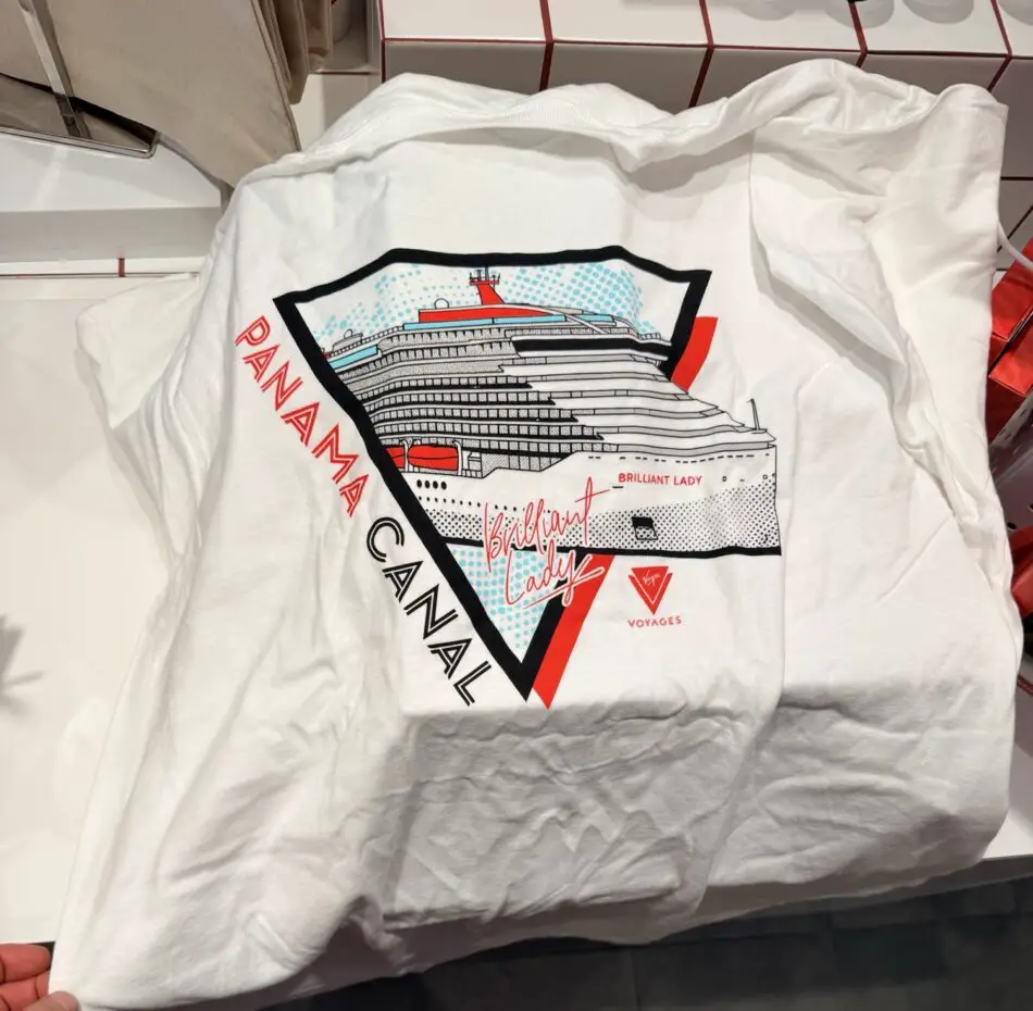 White T-shirt with a Panama Canal cruise ship graphic on a shield-shaped design