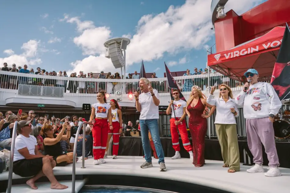 Crowd watches a stage performance aboard a Virgin Voyages cruise ship
