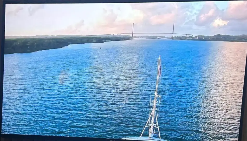 View from a cruise ship bow toward a distant bridge