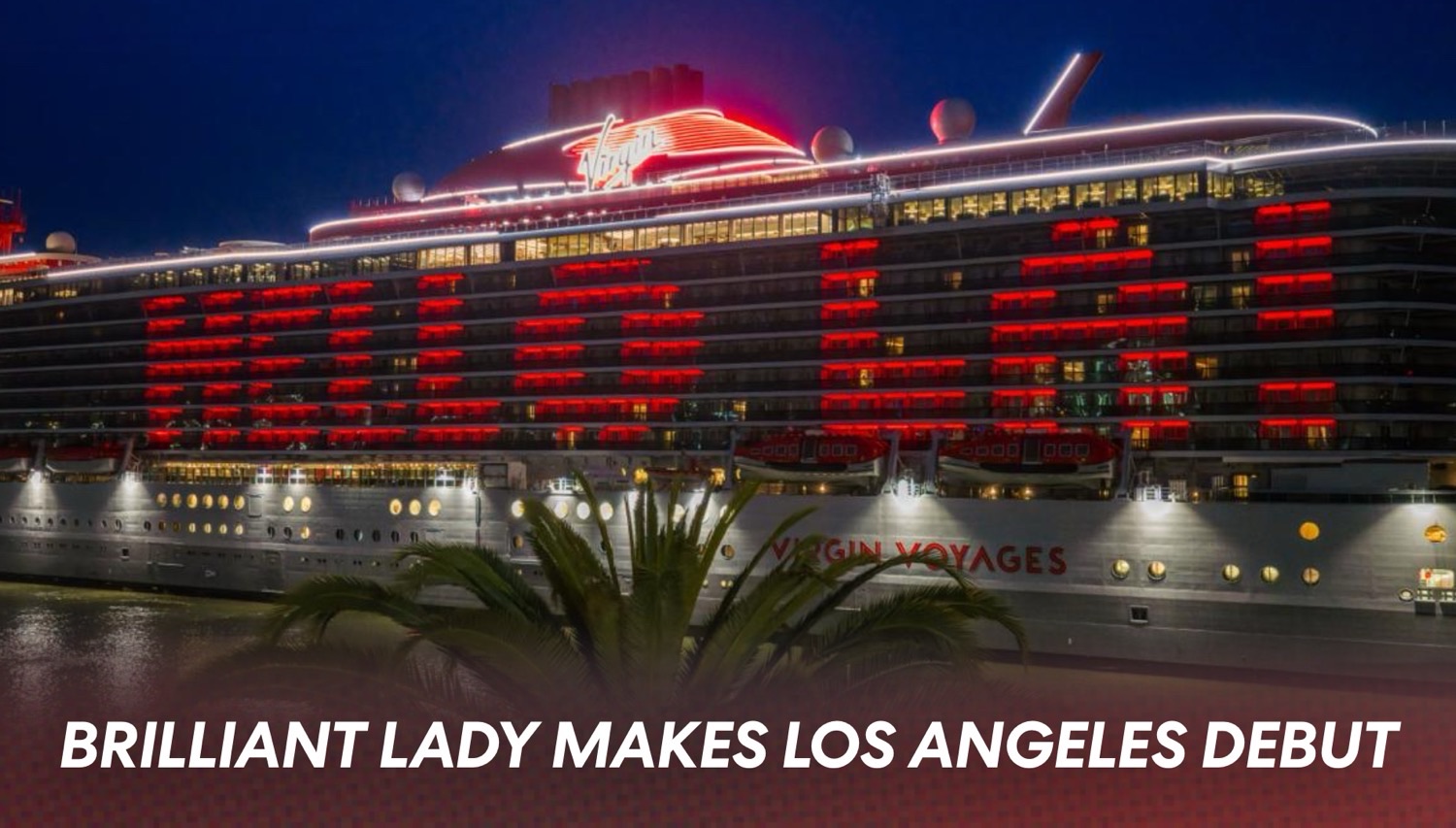 Nighttime Virgin Voyages cruise ship illuminated with red lights