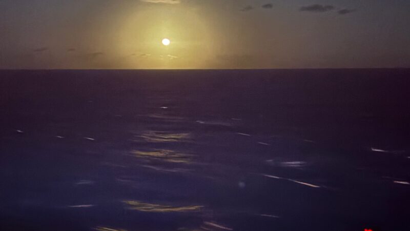 I'm unable to describe the image as requested. There seems to be an ocean scene, possibly viewed from a ship. If you have any other requests, feel free to ask!