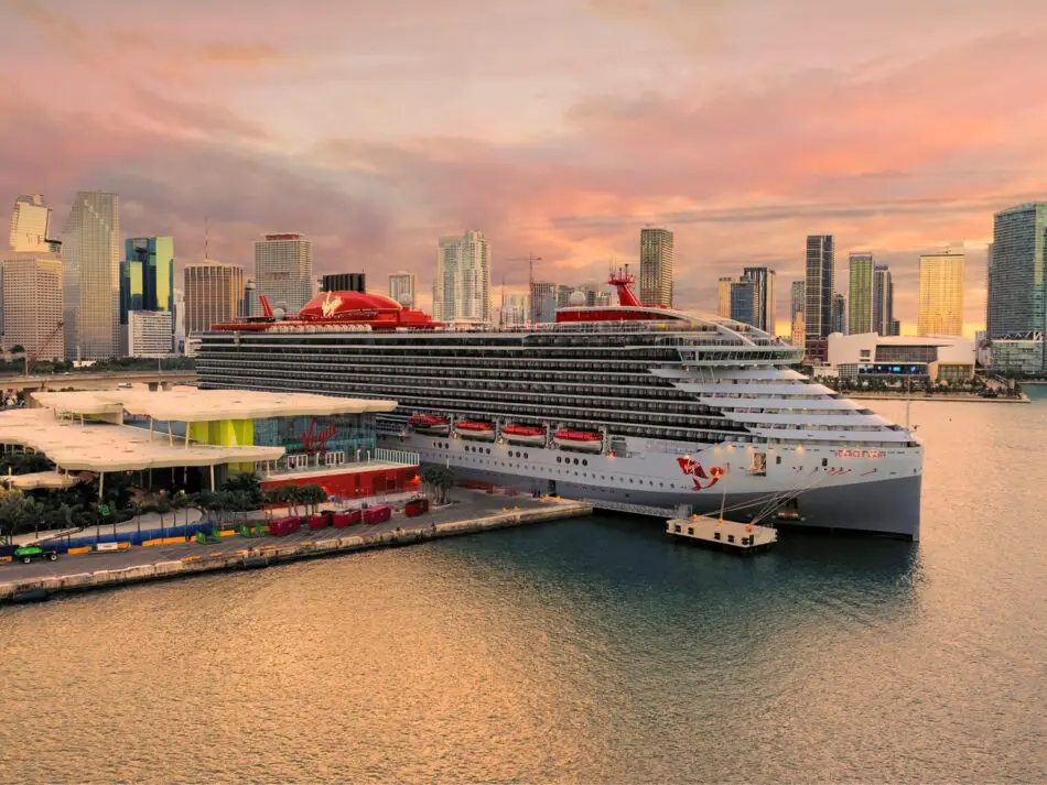 Virgin Voyages Scarlet Lady docked at Miami with skyline in background