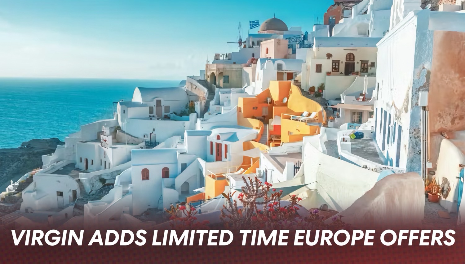 Santorini-style whitewashed hillside village overlooking the blue Aegean Sea